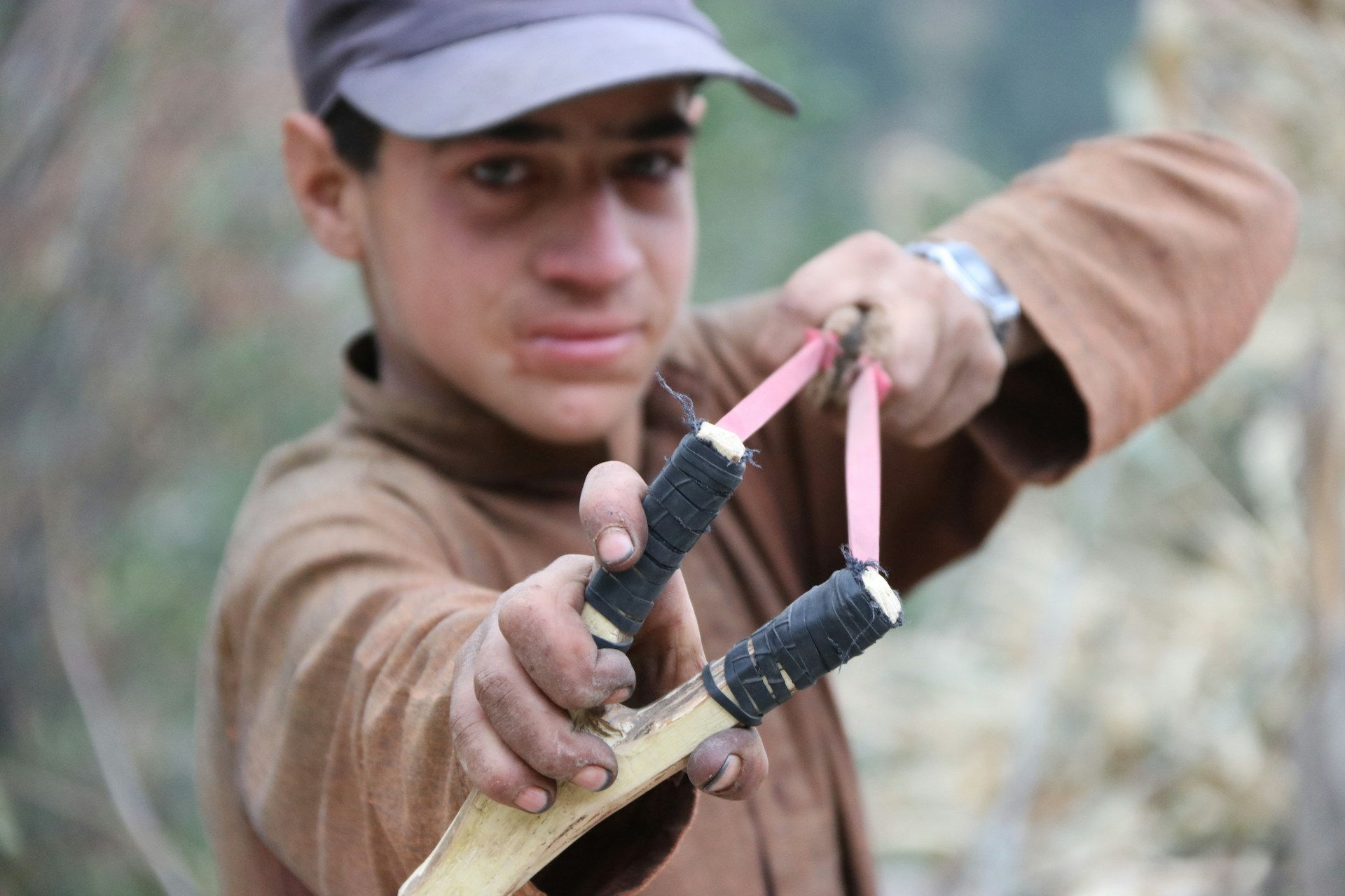 man using slingshot outdoors for recreational shooting in South Africa